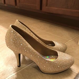 Women’s gold and rhinestone heels